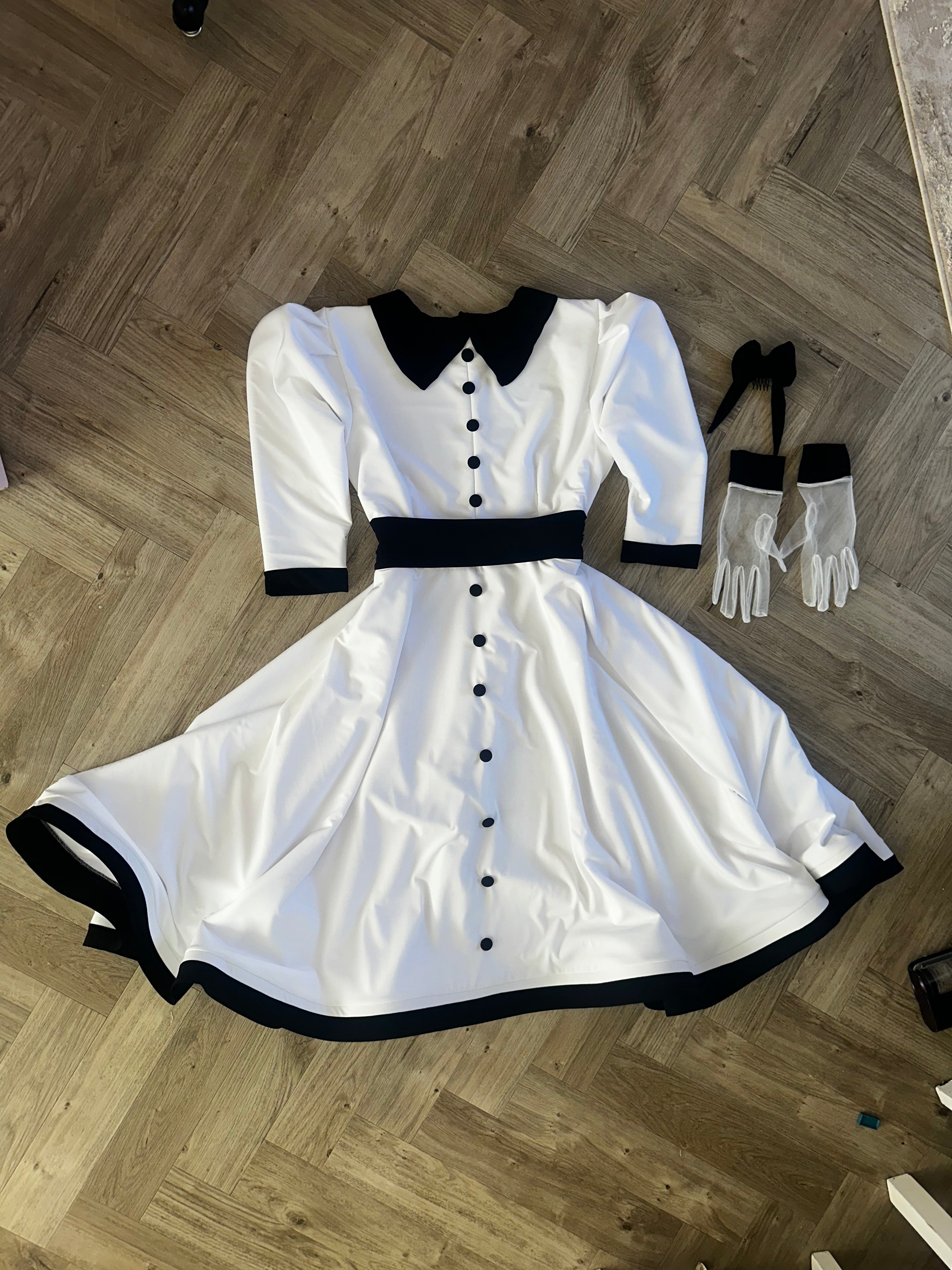 White and black midi length dress