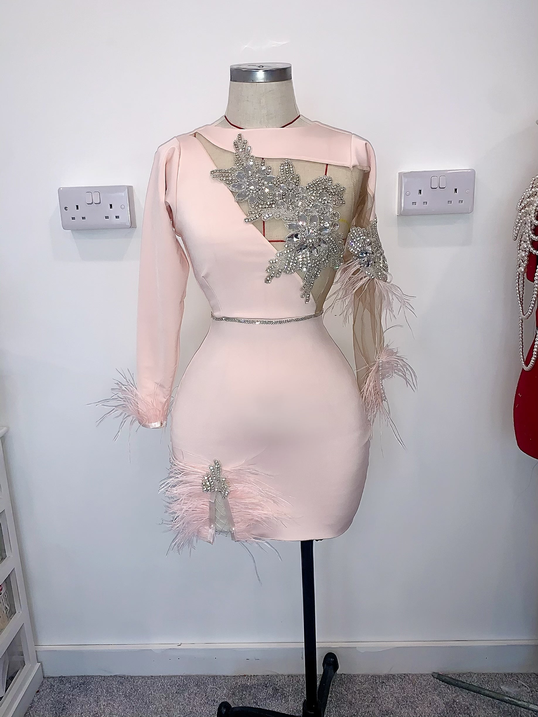 Cut out dress with feather and