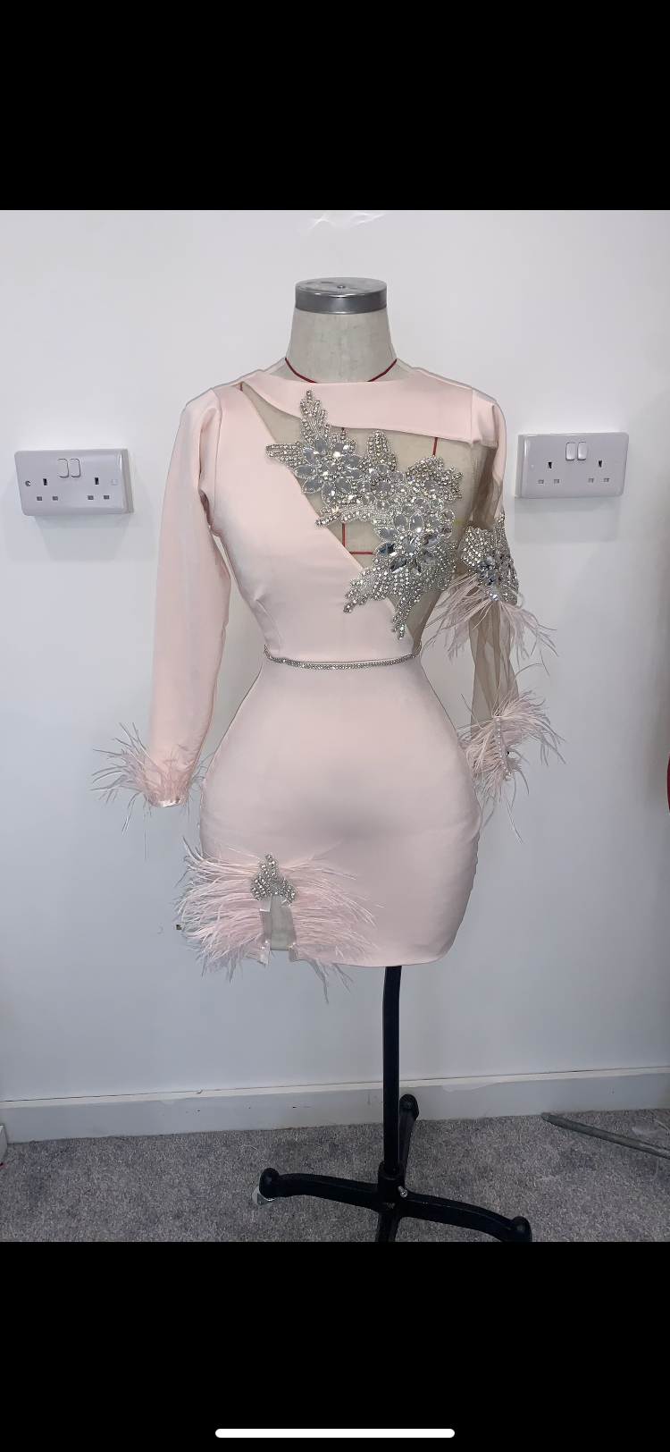 Cut out dress with feather and